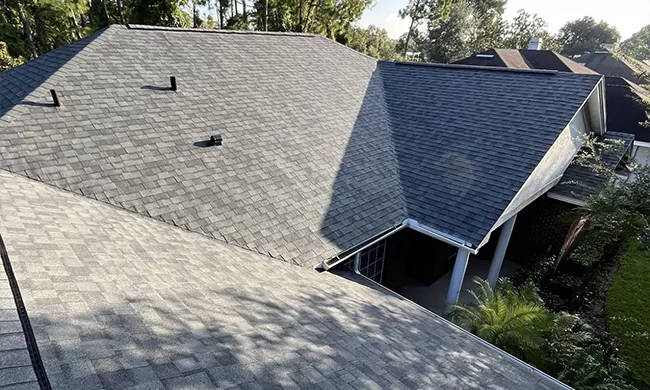 residential-asphalt-shingle-roofing-replacement-massachusetts.webp" alt="High-quality gray asphalt shingle roof replacement built to withstand New England weather